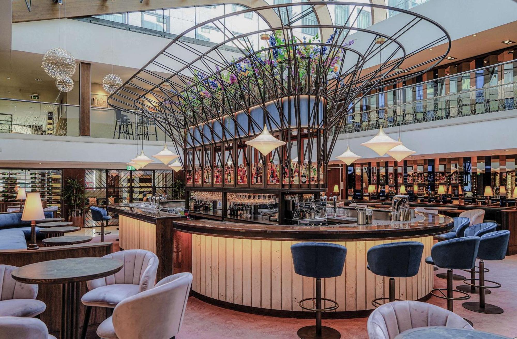 Hilton The Hague Hotel Kültér fotó The bar at the 2018-opened, 100-metre-long, 1,000-seat, 10-storey, 10,000-square-metre (110,000 sq ft) terminal